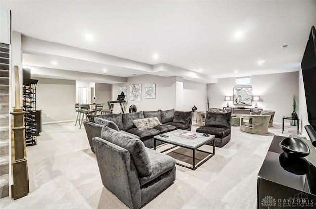 living room featuring light carpet, stairway, baseboards, and recessed lighting