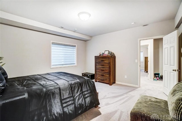 bedroom featuring light carpet, visible vents, and baseboards