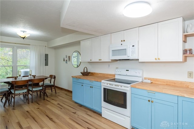 kitchen featuring white appliances, wooden counters, blue cabinetry, light wood-type flooring, and open shelves