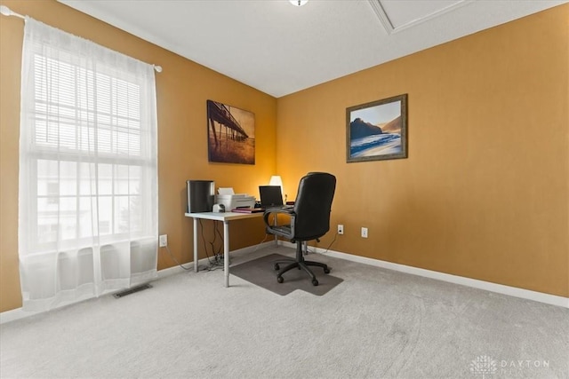 office area featuring carpet, visible vents, and baseboards