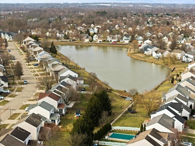 birds eye view of property with a residential view and a water view