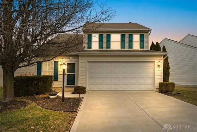 traditional home with an attached garage and driveway