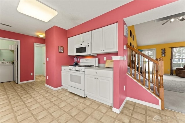 kitchen with visible vents, white cabinetry, washer / dryer, white appliances, and baseboards