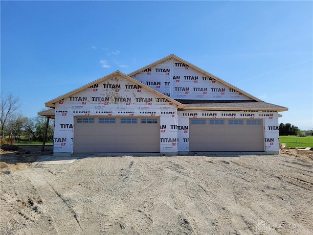 property in mid-construction with a garage