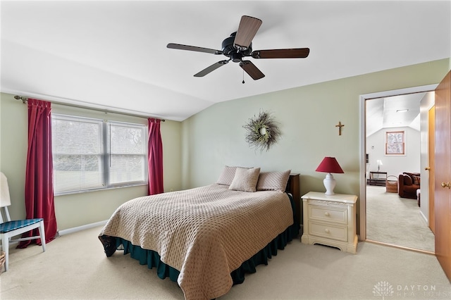 bedroom with lofted ceiling, light colored carpet, ceiling fan, and baseboards