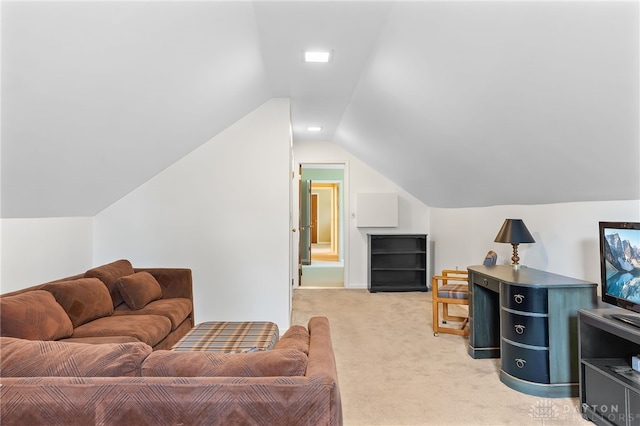 living room featuring vaulted ceiling and light colored carpet