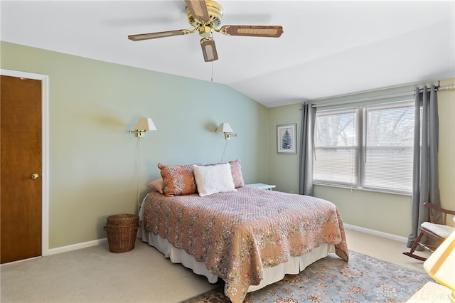 bedroom with vaulted ceiling, carpet flooring, a ceiling fan, and baseboards