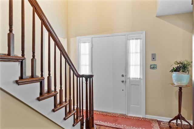 entrance foyer with stairway and plenty of natural light