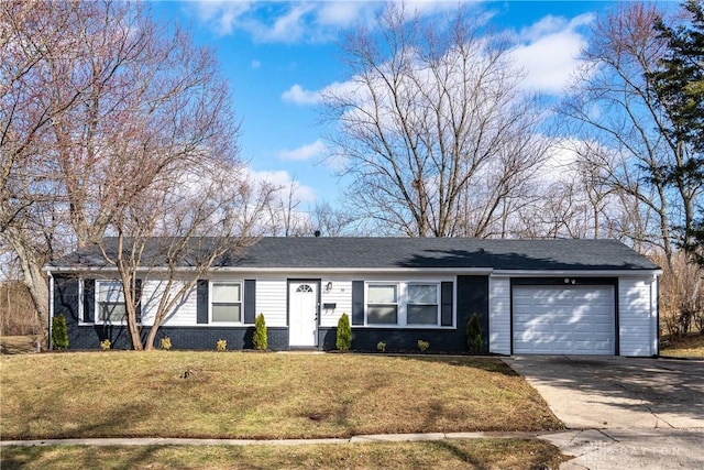 single story home with a garage, concrete driveway, a front lawn, and brick siding