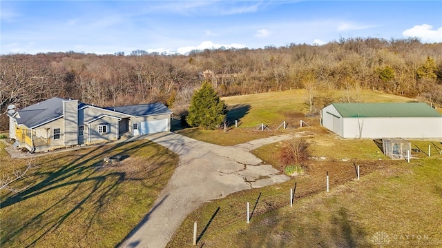 aerial view featuring a wooded view