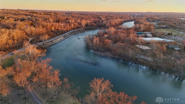 aerial view at dusk with a water view