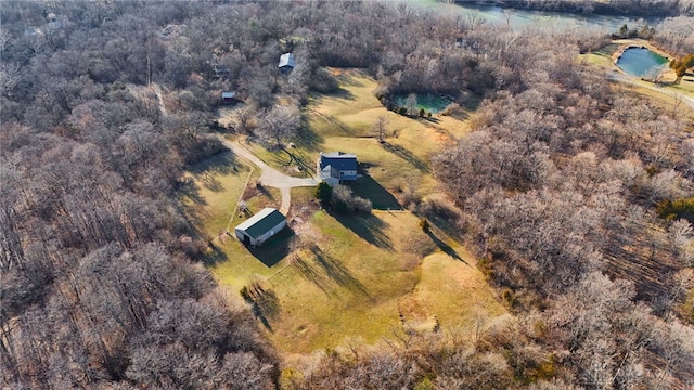 drone / aerial view featuring a forest view