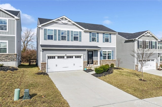 craftsman house featuring driveway, stone siding, an attached garage, and a front yard