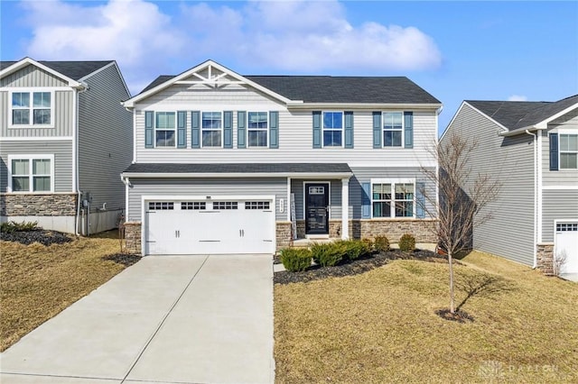 craftsman-style house with driveway, stone siding, an attached garage, and a front yard