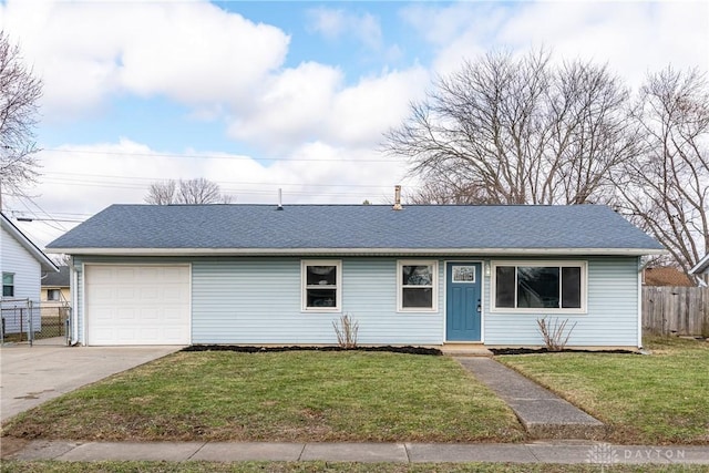 single story home with an attached garage, fence, a front lawn, and concrete driveway