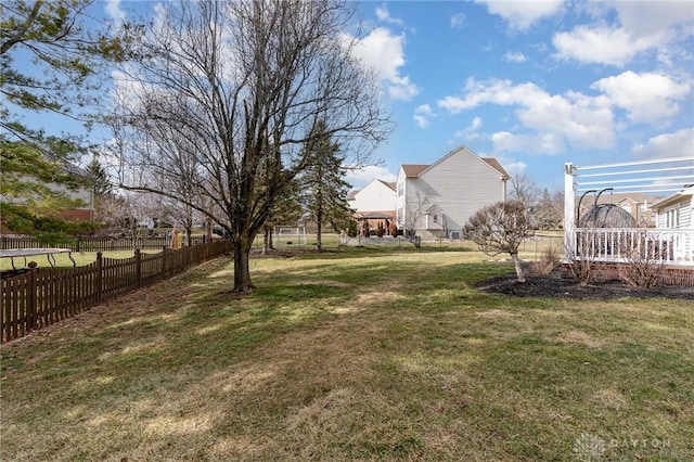 view of yard featuring fence and a pergola