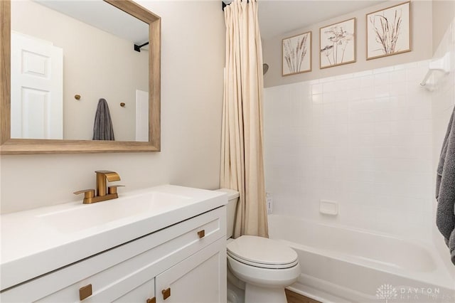 bathroom with shower / bath combination with curtain, vanity, and toilet