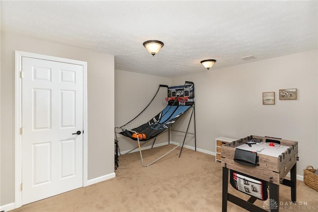 game room featuring carpet, visible vents, and baseboards