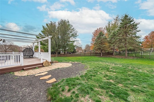 view of yard with fence and a wooden deck