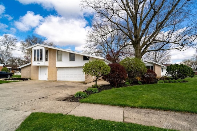 view of front of property featuring concrete driveway, brick siding, a front lawn, and an attached garage