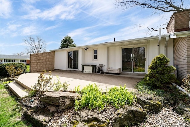 back of property with a patio area