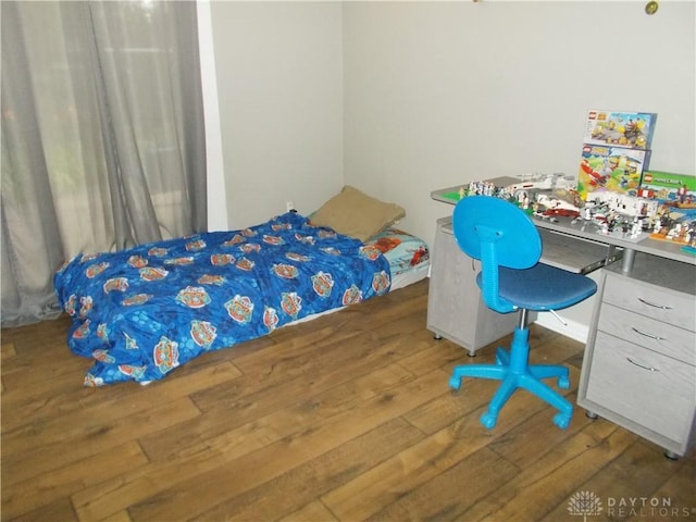 bedroom featuring wood finished floors