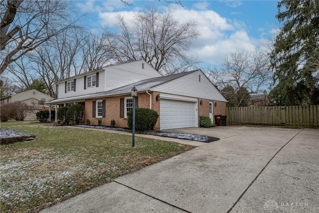 view of front of home featuring an attached garage, brick siding, fence, concrete driveway, and a front yard