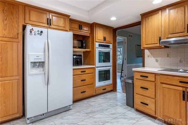 kitchen with visible vents, marble finish floor, under cabinet range hood, light countertops, and black appliances