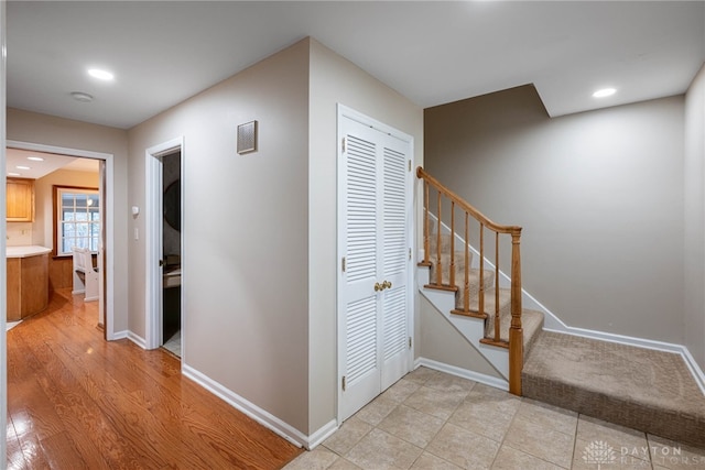 interior space featuring stairs, recessed lighting, and baseboards