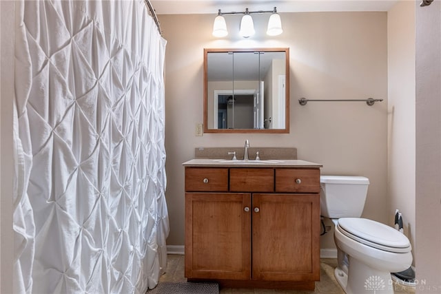 bathroom with toilet, curtained shower, and vanity