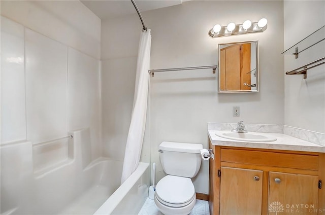 bathroom featuring toilet, shower / tub combo with curtain, and vanity