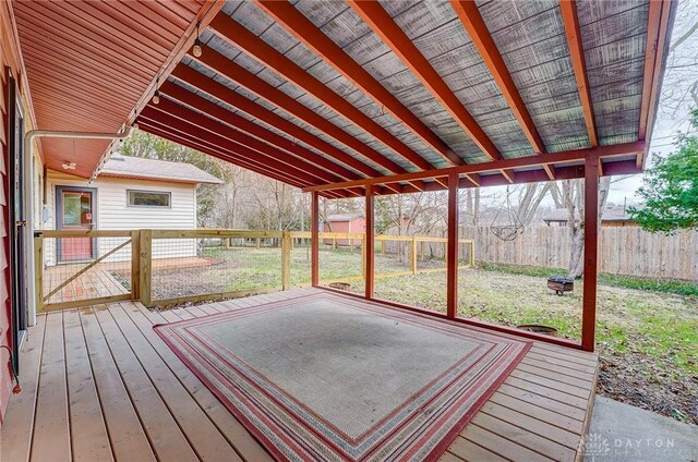 unfurnished sunroom with vaulted ceiling