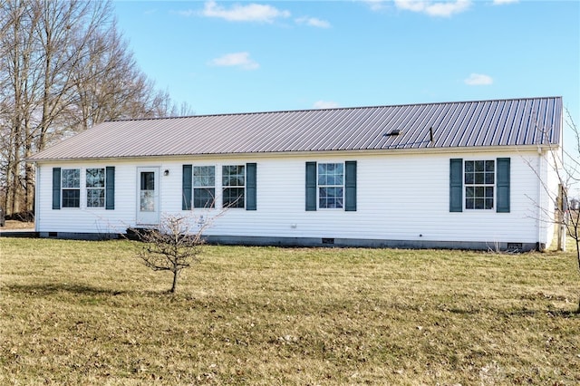 ranch-style house featuring crawl space, metal roof, and a front yard