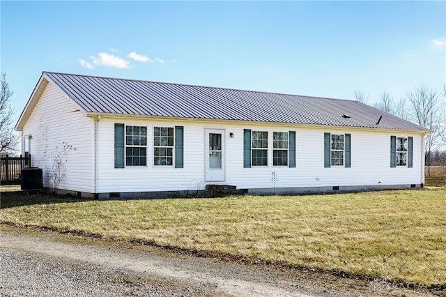 ranch-style house with metal roof, central AC unit, crawl space, and a front yard