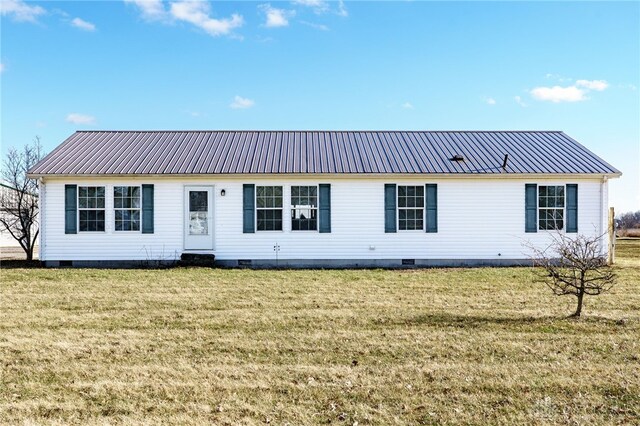 ranch-style home with metal roof, crawl space, and a front yard