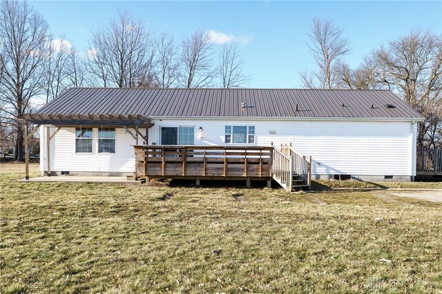 rear view of house with crawl space, metal roof, a lawn, and a wooden deck