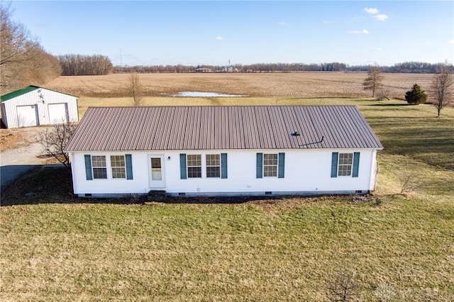 view of front of house with a detached garage, a front yard, crawl space, metal roof, and a rural view