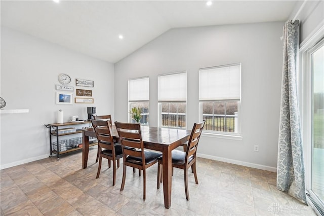 dining area with lofted ceiling, baseboards, and recessed lighting