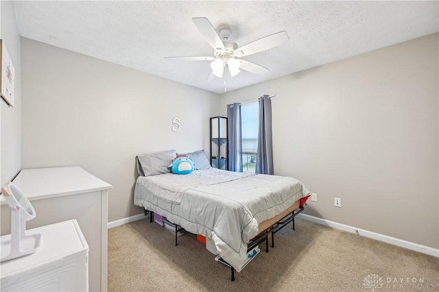 bedroom with baseboards, a ceiling fan, and light colored carpet