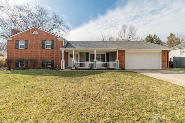 split level home featuring driveway, an attached garage, a porch, and a front yard