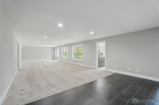 6976 Rosecliff Pl, Dayton, OH 45459 - unfurnished living room featuring recessed lighting, baseboards, and dark carpet
