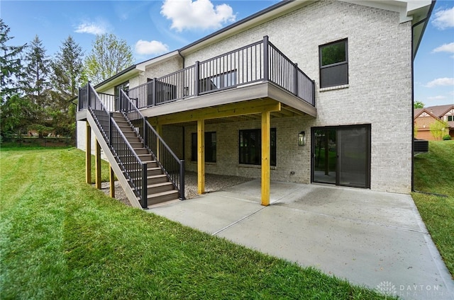 6976 Rosecliff Pl, Dayton, OH 45459 - rear view of house with brick siding, a yard, a patio, a deck, and stairway