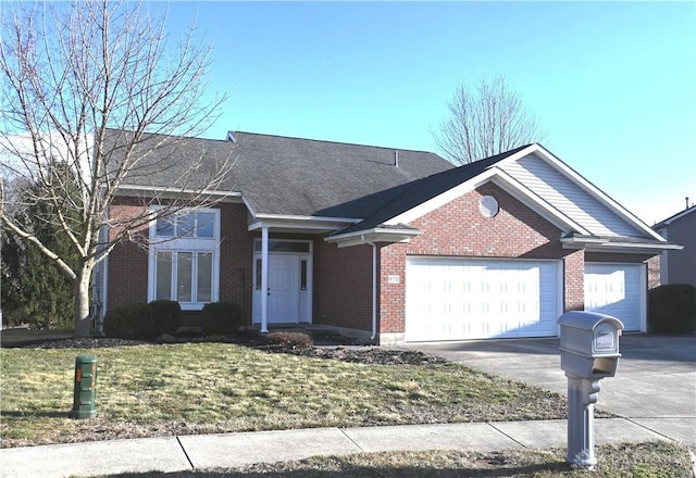 ranch-style house with driveway, brick siding, a front lawn, and an attached garage