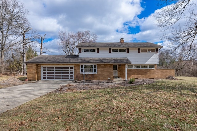 view of front of house with a garage, a chimney, a front lawn, and concrete driveway