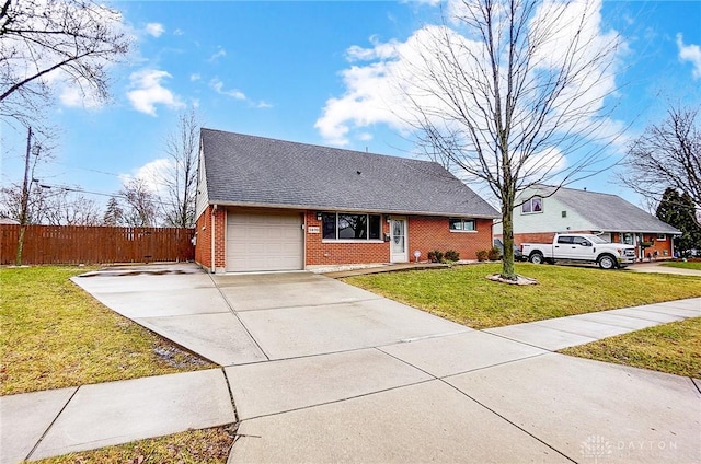 view of front facade featuring brick siding, an attached garage, fence, a front yard, and driveway