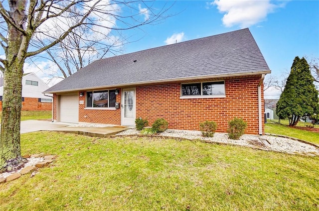 rear view of house featuring driveway, a shingled roof, a garage, a lawn, and brick siding