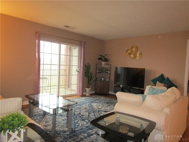 living room featuring baseboards