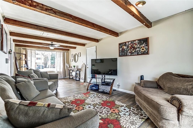 living area with a ceiling fan, baseboards, dark wood finished floors, and beam ceiling