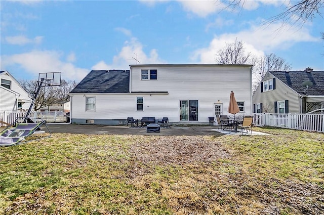 back of property featuring a yard, a patio area, and fence