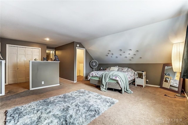 bedroom featuring lofted ceiling, carpet flooring, and baseboards